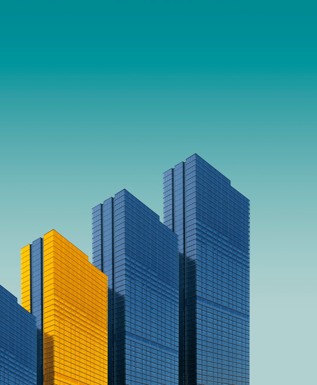 blue-and-yellow-curtain-wall-building-during-daytime-exbqahut994